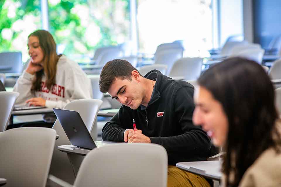 Students working in a classroom on West Campus
