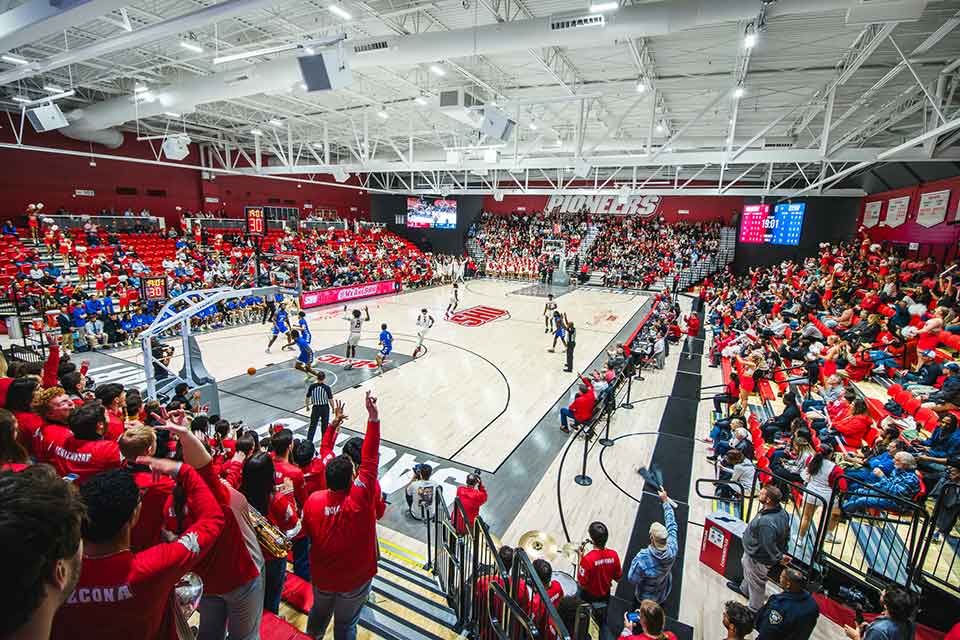 Students show their Pioneer pride by filling the Pitt Center for a basketball game